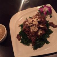 M10. Citrus Soy Protein · Soy protein in a sweet citrus sauce topped with almonds over a bed of kale. With brown rice ...