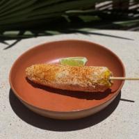 Elote · Corn on the cob, mayo, cotija, and tajin.