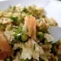 Farfalle Al Salmone · Pasta with salmon, peas and a touch of pink cream sauce. 