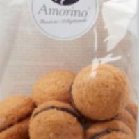 Bacio Di Dama · An timeless Italian delicacy, the Bacio di Dama is a crispy cookie made from Piedmont Hazeln...