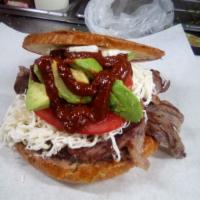 Carne Azada Cemita · Grilled beef. Homemade sesame seed roll, layered with refried beans, pulled out oaxaca chees...