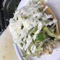 2 Pollo Tostadas · Chicken. Crispy corn tortilla, topped with refried beans, lettuce, sour cream and grated che...