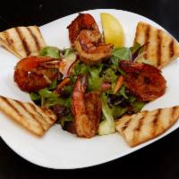 The Greek Goddess Salad · Grilled marinated shrimp, feta cheese, Kalamata olives, tomatoes, cucumbers, red onions, fie...