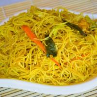 Singapore Fried Rice Noodles · Fresh rice noodles stir fried with fresh vegetables in a slightly spicy yellow curry - delic...