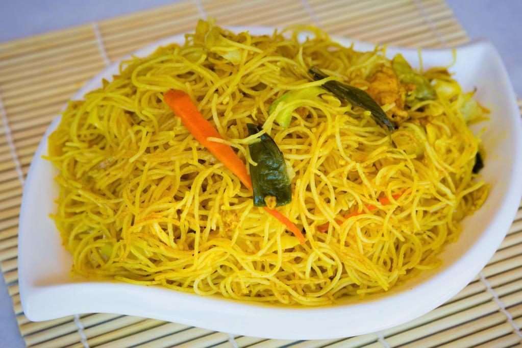 Singapore Fried Rice Noodles · Fresh rice noodles stir fried with fresh vegetables in a slightly spicy yellow curry - delicious.