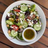 Greek Salad · Organic romaine, cucumber, cherry tomato, chickpeas, Kalamata olives, feta, w/ house made ci...