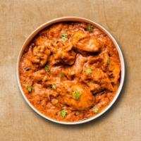 Classic Chicken Tikka Triumph · Cubes of chicken cooked in the tomato sauce and cream with indian spices.

