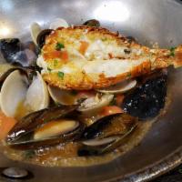Risoto Pescatore · Calamari, mussels, clams shrimp in marinara sauce.