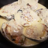 Clams Casino · Baked clams stuffed with bacon, caramelized onions, peppers sauteed in mango habanero cream ...