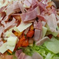 Chopped  Salad · Chopped romaine lettuce, tomatoes, cucumber, onions, roasted peppers, salami, capicola, ham ...
