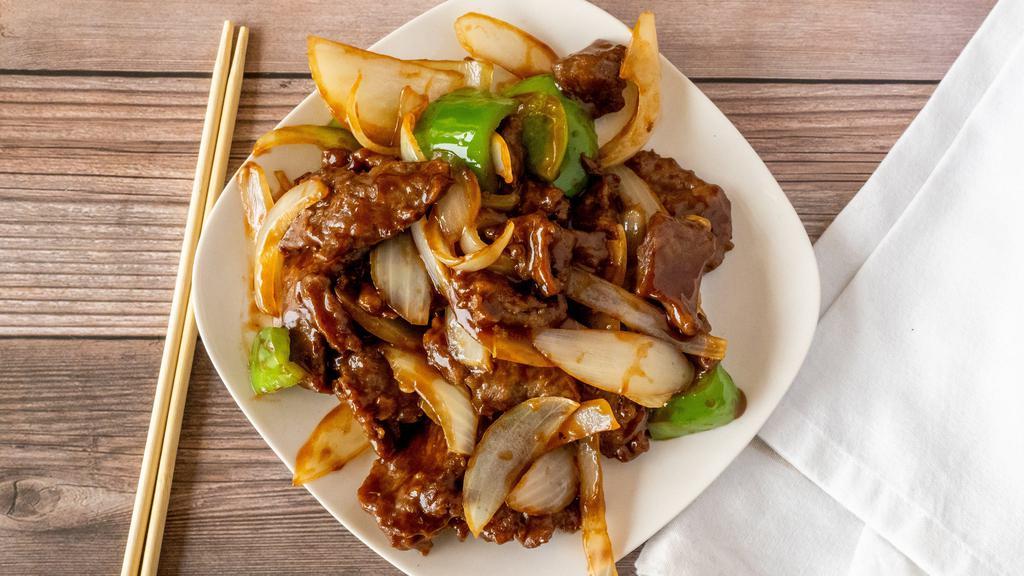 57. Pepper Steak with Onions · Stir fried steak with vegetables and a savory sauce.