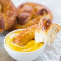 Pretzel with Mustard · Pretzel with Mustard. Our Homemade Artisan Beer Queso can be added.