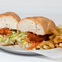 Buffalo Chicken Poboy · Crispy chicken tenders tossed in buffalo sauce with lettuce, tomato and ranch dressing