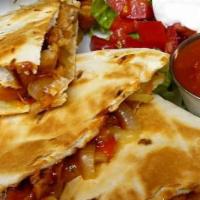 Muchas Quesadillas · Diced grilled chicken or steak with shredded cheese inside a flour tortilla. Served with sou...