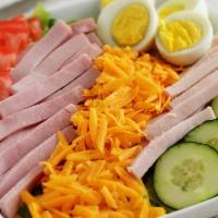 Chef Salad · Sliced turkey and ham, tomatoes, cucumbers, American and provolone cheese and sliced eggs at...