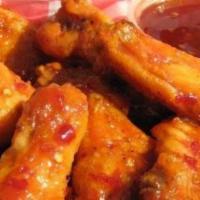 Thai Chili Wings · Thai style chili sauce is a balanced blend of red chili paste and cayenne mixed with vinegar...