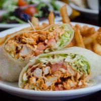 Buffalo Chicken Wrap · Buffalo style chicken with bleu cheese wrapped with shredded lettuce and tomato slices. Serv...