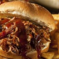 Carolina BBQ Sandwich · Slow-cooked pulled pork shoulder in an eastern Carolina vinegar sauce served with choice of ...