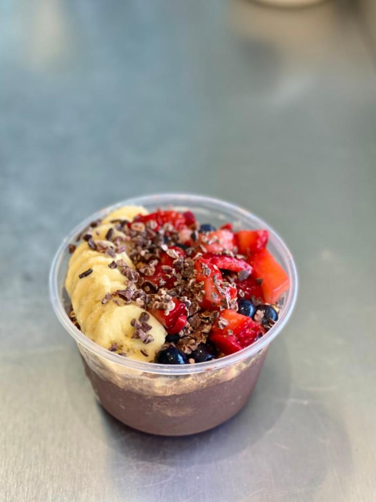 Powerhouse Bowl · Açaí, chocolate whey protein, blueberries, strawberries, bananas, cacao nibs and granola.