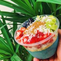 Mystery Blue Bowl · Base: Banana, mango, Blue Spirulina, fresh pressed apple juice 

Toppings: Kiwis, blueberrie...