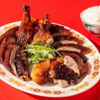 Cantonese Roast Duck 1/2  · Cantonese roast duck served with rice and pickles. Includes house-made duck sauce.