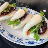 Roast Duck Buns  (3) · Three (3) folded steamed buns filled with tender slices of our signature roast duck, hoisin,...