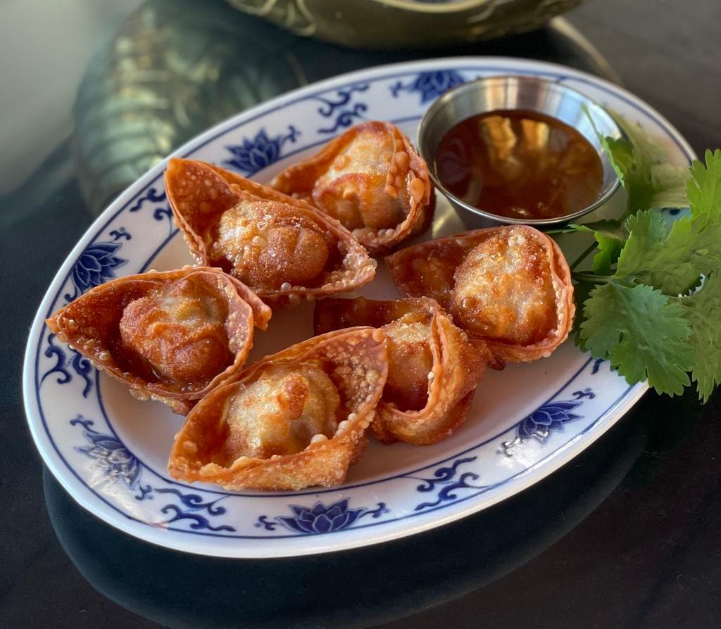 Fried Duck Shiitake Wonton · DUMPLING WEEK SPECIAL! Lucky New Year fried wontons (6) in the shape of ingots, stuffed with duck, shiitake mushrooms, and Napa cabbage. Served with a tangy garlic sauce. Ingots symbolize good fortune in the new year.