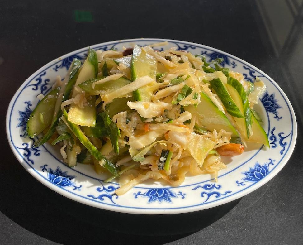 Cucumber Cabbage Salad · Cucumbers, cabbage, peanuts tossed in soy dressing 