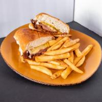 The Cuban Sandwich · El Cubano!! ham, roasted pork, Swiss cheese, pickles, mustard.