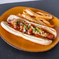 Perro Caliente · A signature Steelhouse plate! Foot long American dog wrapped with bacon and loaded with ques...