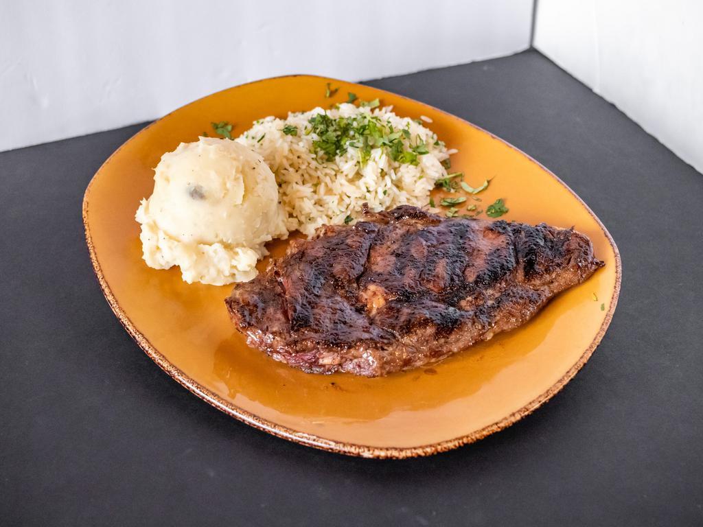 Ribeye  · Delicious prime cut Ribeye, cooked to perfection. Comes with 2 sides of your choice. 12 oz.