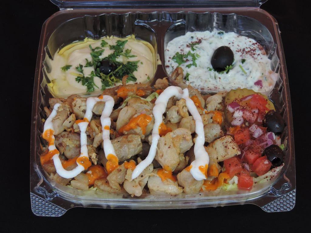 Chicken Plate · Saffron Rice, Romaine Lettuce, Tomato, Onion, Feta cheese, Homemade garlic sauce, Homemade hot sauce, Hummus, Tzatziki, and a Pita Bread