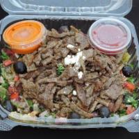 Beef Over Salad  · Romaine Lettuce, Tomato, Onion, Cucumber, Feta cheese, Dressing Salad, and Homemade garlic s...