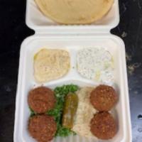 Mezza Plate · 4 falafel pieces, side of tabouli, hummus, baba ganoush, tzatziki, grape leaves and pita bre...