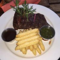 Churrasco Frites · Grilled skirt steak with chimichurri and demi glaze sauce and served with yucca fries.