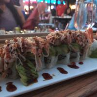 Volcano Roll · Shrimp tempura, cream cheese and avocado topped with salmon
and crabmeat paste.