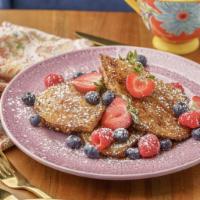 French Toast · Blueberry, strawberry, whipped cream, maple syrup, sugar, and cinnamon

