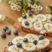 Blueberry Banana Toast · Banana, blueberry, maple syrup, and almond butter or peanut butter
