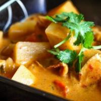 Mussman Curry · Mussaman curry paste with coconut milk, potatoes, carrots, peanut, onions.