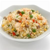Thai Shrimp Fried Rice · Elegant basmati rice stir fried to perfection mixed with basil bean sprouts, chives, and eggs.