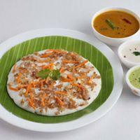 Plain Uttappam · Thick pan cake made with rice and lentil batter, served with sambar and chutney.