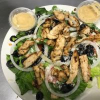 Caesar Salad · Romaine lettuce, tomato, onions, croutons, Romano cheese and black olives.
