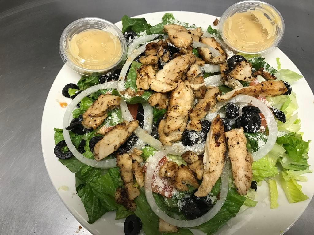 Caesar Salad · Romaine lettuce, tomato, onions, croutons, Romano cheese and black olives.