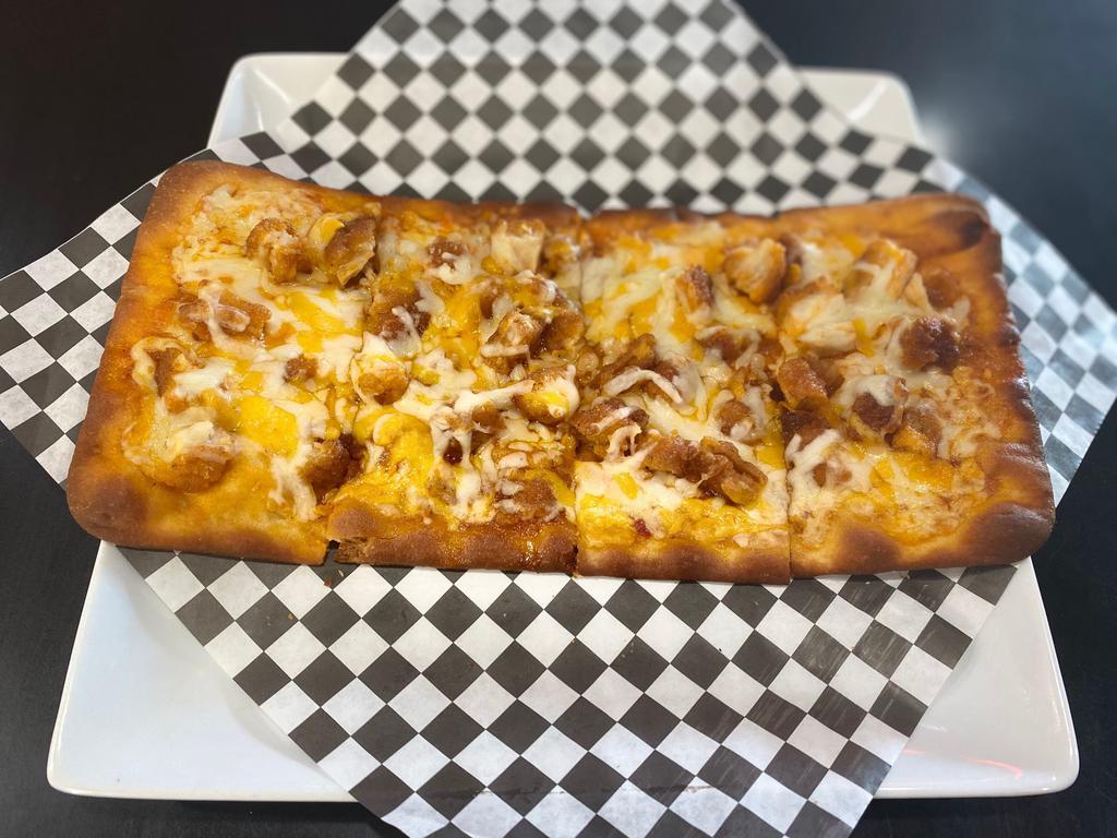 Buffalo Chicken Flatbread Pizza · Made with a base of our famous Buffalo sauce, chicken, mozzarella, and cheddar Jack cheese.