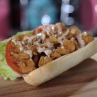 Shrimp Po Boy Sandwich · A large portion of hand breaded shrimp. Served in a hoagie roll with lettuce and tomato, top...