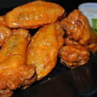 Chicken Wings · Traditional or boneless. Buffalo hot, BBQ, garlic Parmesan. Served with celery and ranch dip...
