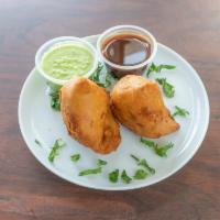 Samosa (2) · Turnovers with potatoes, peas, Indian herbs and spices. Vegetarian. 