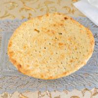 49. Roghani Naan · Whole wheat bread with oil or butter cooked in the tandoor.