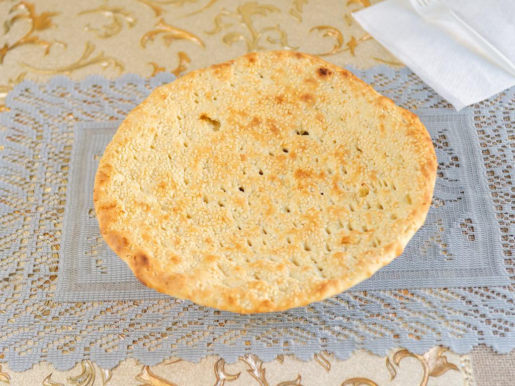 58. Aloo Naan · Bread stuffed with seasoned potato.