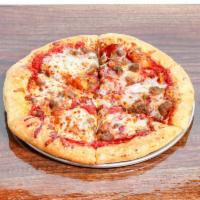 The Carnivore Pizza ·  Canadian bacon, pepperoni, beef, sausage, Italian sausage, bacon, cheddar, mozzarella chees...